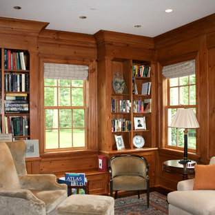 Example of a mid-sized classic dark wood floor and brown floor study room design in New York with no fireplace