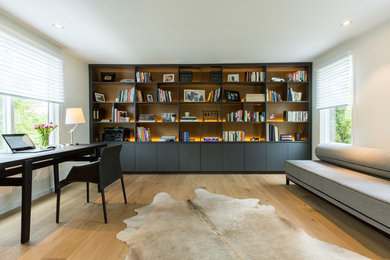 Study room - mid-sized modern freestanding desk study room idea in New York