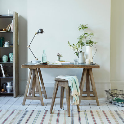Home office - cottage freestanding desk painted wood floor home office idea in London with white walls