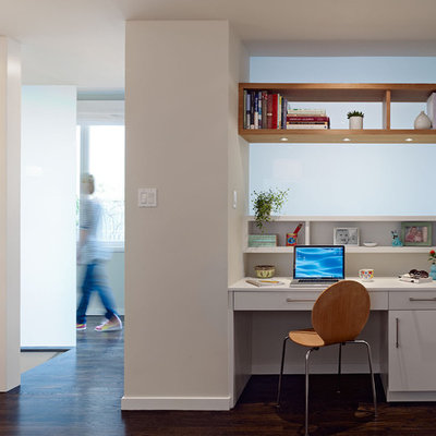 Example of a trendy built-in desk home office design in San Francisco