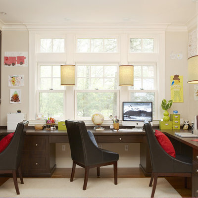 Inspiration for a large timeless built-in desk medium tone wood floor and brown floor home office remodel in Boston with white walls and no fireplace