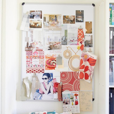Example of a classic home office design in Milwaukee with white walls