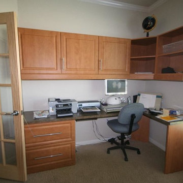 Small home corner office with lots of cabinets