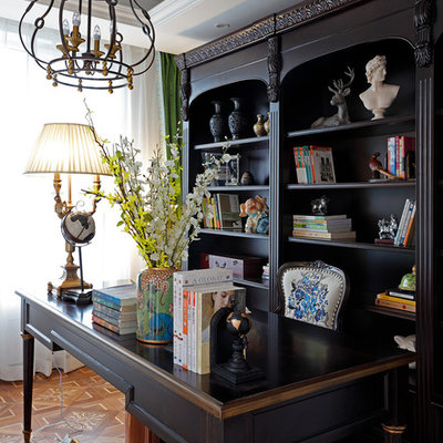 Study room - traditional freestanding desk medium tone wood floor study room idea in Other