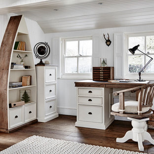 This is an example of a farmhouse study in Other with white walls, dark hardwood flooring, a freestanding desk and brown floors.