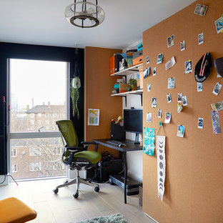 Inspiration for a small contemporary study in London with black walls, light hardwood flooring, no fireplace, a freestanding desk and grey floors.
