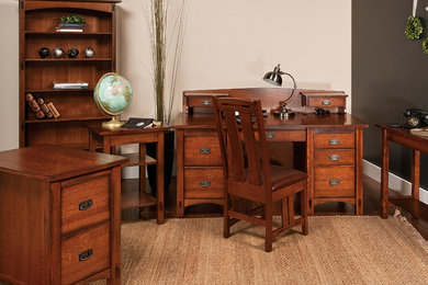 Example of a mid-sized arts and crafts freestanding desk dark wood floor study room design in Other with white walls and no fireplace