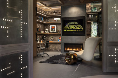 Study room - contemporary built-in desk gray floor study room idea in Sacramento with gray walls and a ribbon fireplace