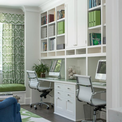 Study room - mid-sized transitional built-in desk dark wood floor study room idea in San Francisco with white walls