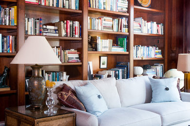 Home office library - large traditional home office library idea in San Francisco with brown walls