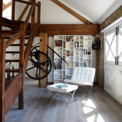 Mid-sized farmhouse home office library photo in London with no fireplace and multicolored walls