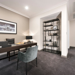This is an example of a contemporary study room in Perth with beige walls, carpet, a freestanding desk and grey floor.