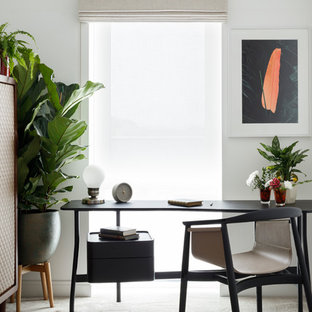 Inspiration for a contemporary study in London with white walls, carpet, no fireplace, a freestanding desk and grey floors.