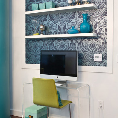 Home office - contemporary freestanding desk dark wood floor home office idea in Los Angeles with white walls