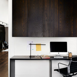Contemporary study room in Melbourne with white walls, carpet and a freestanding desk.