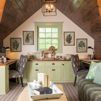 Elegant built-in desk carpeted study room photo in Minneapolis with white walls