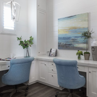 Inspiration for a mid-sized coastal built-in desk dark wood floor and brown floor study room remodel in Sacramento with white walls and no fireplace