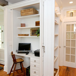 Home office - traditional built-in desk home office idea in New York