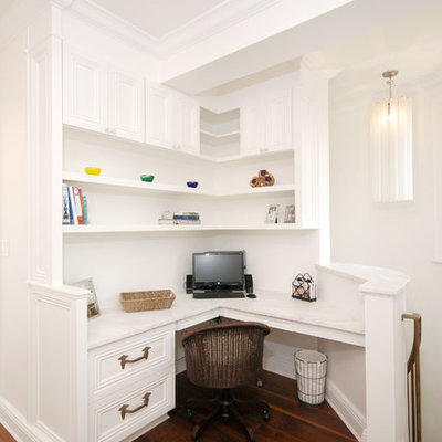 Home office - traditional built-in desk home office idea in New York