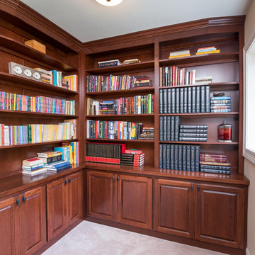 Traditional Library with Cherry Raised Panel Doors and Wood Countertops