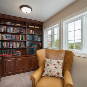 Traditional Library with Cherry Raised Panel Doors and Wood Countertops