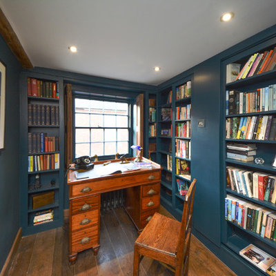 Inspiration for a small cottage freestanding desk dark wood floor study room remodel in Kent with blue walls and no fireplace