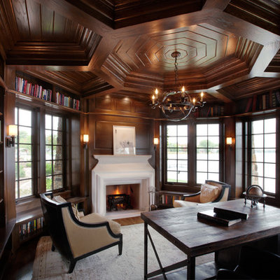 Home office - traditional freestanding desk dark wood floor home office idea in Minneapolis with a standard fireplace