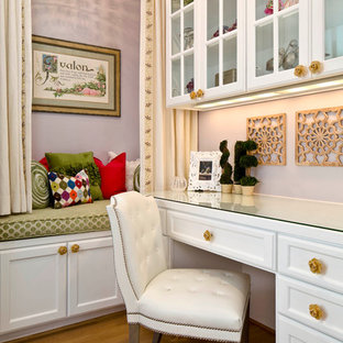 Photo of a traditional home office in Dallas with purple walls, medium hardwood flooring and a built-in desk.