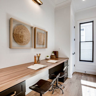 Study room - transitional built-in desk light wood floor study room idea in DC Metro with white walls and no fireplace