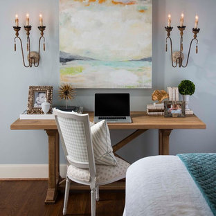 Home office - traditional freestanding desk dark wood floor home office idea in Dallas with blue walls