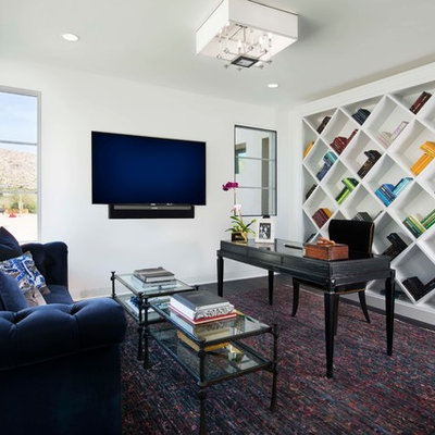 Example of a mid-sized trendy freestanding desk dark wood floor and brown floor study room design in Phoenix with white walls and no fireplace
