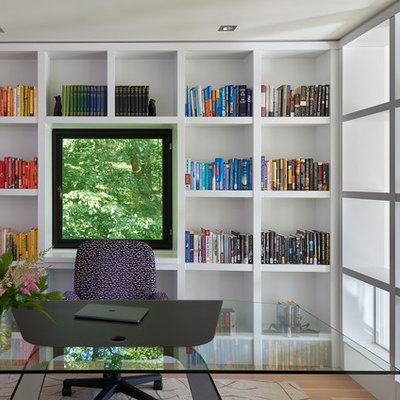 Inspiration for a large contemporary freestanding desk medium tone wood floor and brown floor study room remodel in DC Metro with white walls and no fireplace