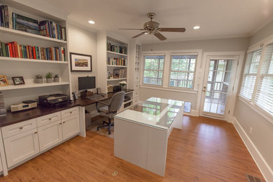 Home office - mid-sized freestanding desk vinyl floor home office idea in Atlanta with gray walls