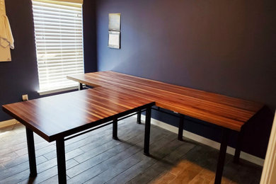 Home office - large modern freestanding desk home office idea in Charleston