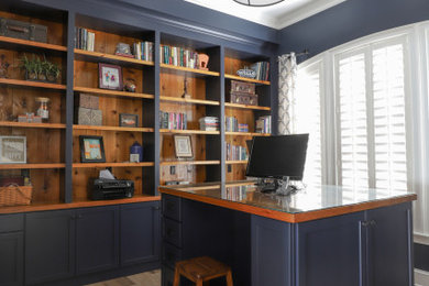 Inspiration for a mid-sized farmhouse freestanding desk porcelain tile, brown floor and coffered ceiling home office remodel in Jacksonville with blue walls