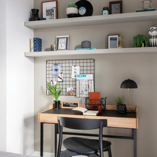 Inspiration for a small contemporary study in London with white walls, carpet, a freestanding desk and grey floors.