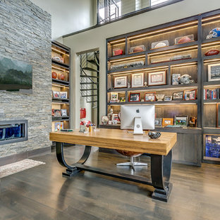 Inspiration for a transitional study room in Dallas with beige walls, dark hardwood floors, a ribbon fireplace and a freestanding desk.