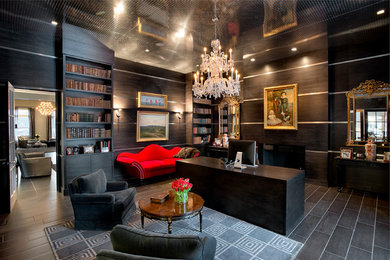 Example of a large eclectic freestanding desk dark wood floor and brown floor study room design in New York with brown walls and a standard fireplace