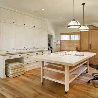 Example of a large transitional freestanding desk light wood floor and beige floor home studio design in Dallas with white walls and no fireplace