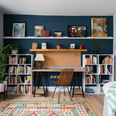 Study room - mid-sized contemporary freestanding desk light wood floor and beige floor study room idea in London with white walls