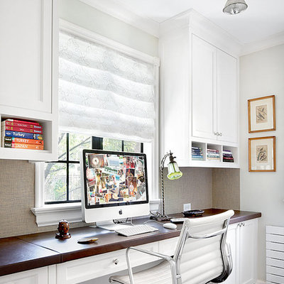 Elegant built-in desk home office photo in Chicago