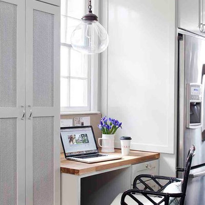 Study room - mid-sized transitional built-in desk medium tone wood floor study room idea in Atlanta with gray walls