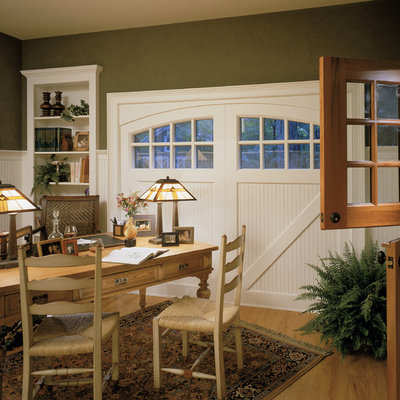 Inspiration for a timeless freestanding desk medium tone wood floor home office remodel in New York with green walls