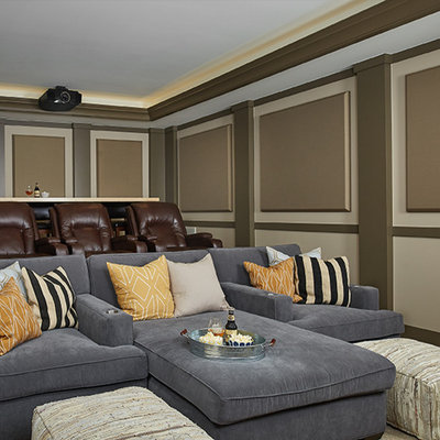 Large transitional enclosed carpeted and beige floor home theater photo in Grand Rapids with beige walls and a projector screen