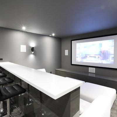 Inspiration for a mid-sized contemporary enclosed carpeted and gray floor home theater remodel in Vancouver with gray walls and a projector screen