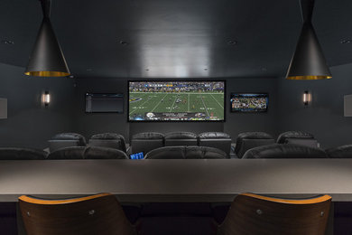 Home theater - large contemporary enclosed carpeted home theater idea in Salt Lake City with gray walls and a projector screen