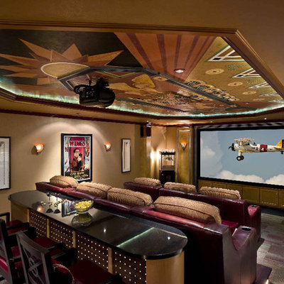 Large elegant enclosed carpeted and multicolored floor home theater photo in Other with beige walls and a projector screen