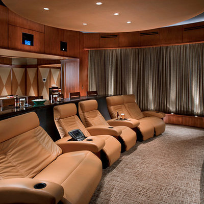 Home theater - huge contemporary enclosed carpeted home theater idea in Los Angeles with brown walls and a projector screen