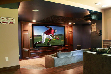Home theater - contemporary open concept home theater idea in Other with a projector screen