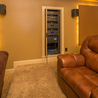 Mid-sized minimalist enclosed carpeted and beige floor home theater photo in Raleigh with beige walls and a projector screen